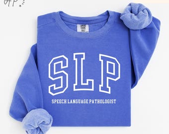 May include: A blue sweatshirt with the text "SLP" in white, which stands for "Speech Language Pathologist".