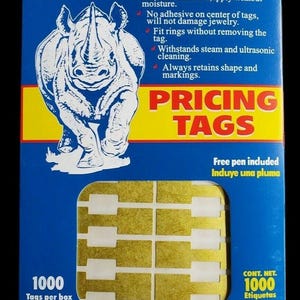 May include: A blue and yellow box of jewelry repair and identification tags. The box features a rhino illustration and the words "PRICING TAGS". The box contains 1000 tags per box, made with Tyvek.