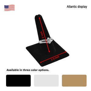 May include: Black velvet ring display stand with a 2 inch tall cone and a 2 1/4 inch square base. Available in black, white, and brown.