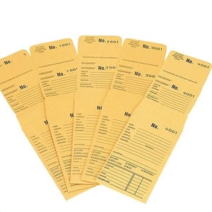 May include: A collection of tan paper envelopes with printed text and lines for writing. Each envelope is labeled with a number, such as "No. 1001" and "No. 4001". The envelopes are arranged in a fan shape.