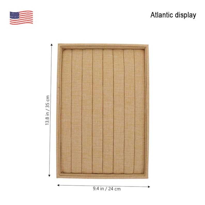 May include: A beige ring display box with 10 slots for storing rings. The box measures 9.4 inches by 13.8 inches.