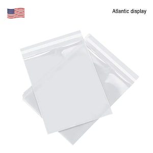 May include: Two clear plastic bags with a self-adhesive seal. The bags are stacked on top of each other.