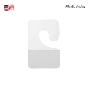 May include: White plastic hang tag with a hook at the top and a blank rectangular space for writing. The tag is designed for hanging items on a display rack.