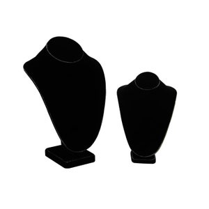May include: Two black velvet necklace display stands. The larger stand is taller and has a wider base. The smaller stand is shorter and has a narrower base.