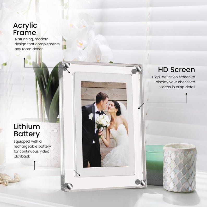 May include: A clear acrylic picture frame with a white mat and a built-in digital screen. The frame is displaying a photo of a wedding couple. The text "Acrylic Frame" is in the top left corner, "Lithium Battery" is in the bottom left corner, and "HD Screen" is in the top right corner.