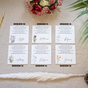 May include: Nine seed paper place cards with floral designs and handwritten names. Each card features a unique design, including yellow flowers, blue wildflowers, and watercolor accents. The names include Johnson, Charlotte, Jordan, Brianna, and Steven.