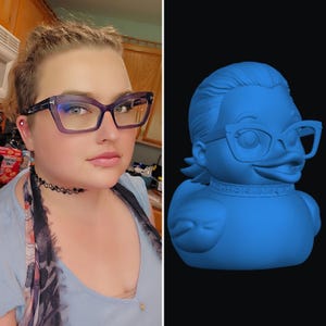 May include: A split image showing a person with purple-framed glasses and a 3D-rendered blue duck figurine, also wearing glasses. The duck has a stylish hairstyle and a decorative collar. The background is black.