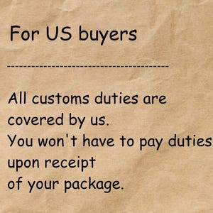 May include: Text on a tan background reads "For US buyers" followed by a dashed line. Below, it states "All customs duties are covered by us. You won't have to pay duties upon receipt of your package."