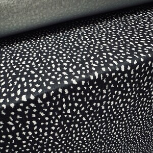 Textured strawcloth stretch double jersey fashion fabric, per metre - asteroid print - black & white