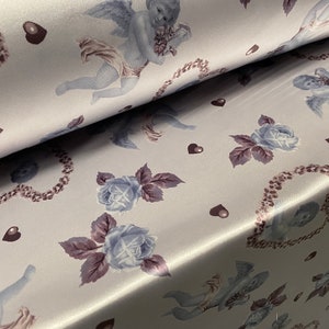 Silky Stretch charmeuse satin dress fabric, per metre - Cupid in a love heart print - silver blue