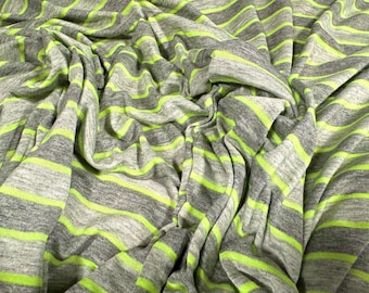 May include: Gray and lime green striped fabric with a soft, textured feel. The fabric is folded and draped, showing the texture and pattern.