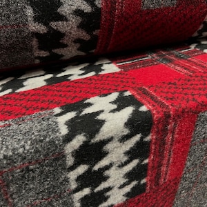 May include: Red, black, and white patterned fabric with a fuzzy texture. The fabric has a houndstooth pattern and a plaid pattern.