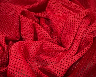 May include: Red mesh fabric with a small diamond pattern. The fabric is wrinkled and folded.