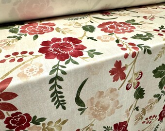 May include: Cream-colored fabric with a floral pattern featuring large red roses, smaller pink flowers, and green leaves. The design is repeated across the fabric, creating a cohesive and decorative look. Ideal for home decor projects.