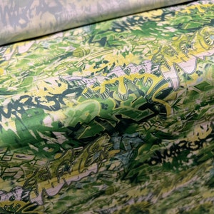 Sateen single jersey fabric, per metre - graffiti print - green