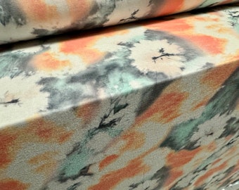 Zachte stretch single jersey stof, per meter - tie-dye bloemenprint - aqua & perzik