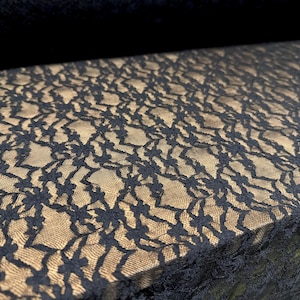 Stretch spandex lace fabric, per metre - stylised daisies - black