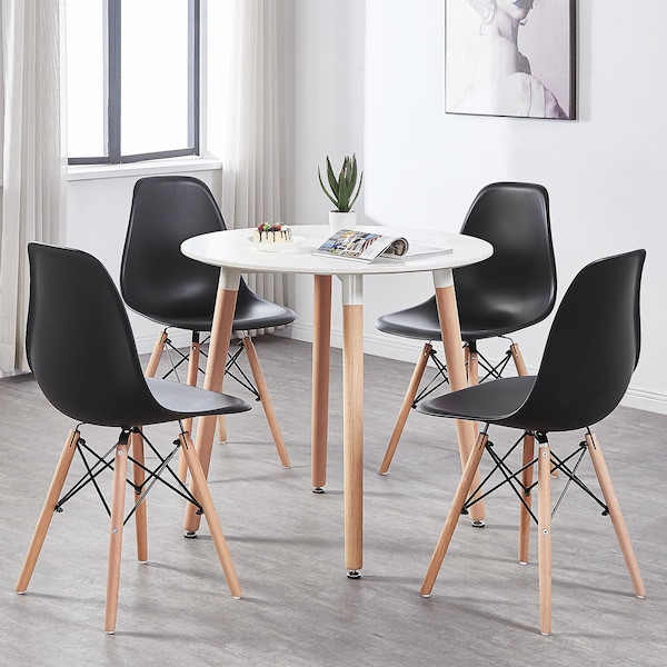 Contemporary dining set with a black and white round table and 4 Eiffel style plastic chairs with wooden legs in a Nordic style