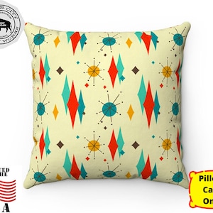 May include: A yellow, red, blue, and white geometric pillow case with a mid-century modern design. The pillow case features a repeating pattern of stars and diamonds.