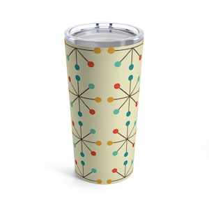 May include: A stainless steel tumbler with a cream background and a geometric pattern of red, yellow, blue, and teal circles connected by thin black lines.