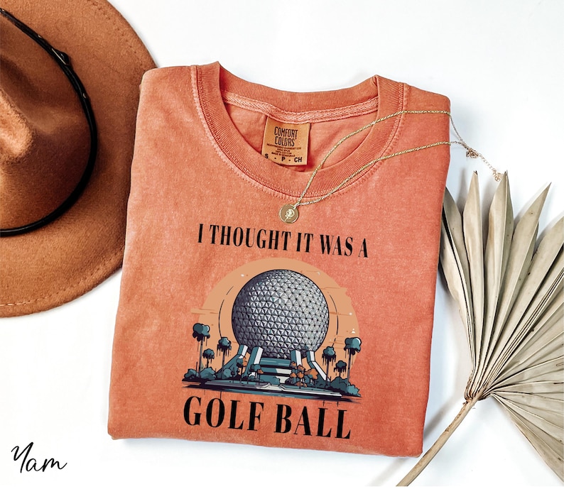 a t - shirt that says i thought it was a golf ball