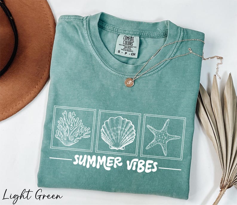 a t - shirt that says summer vibes on it