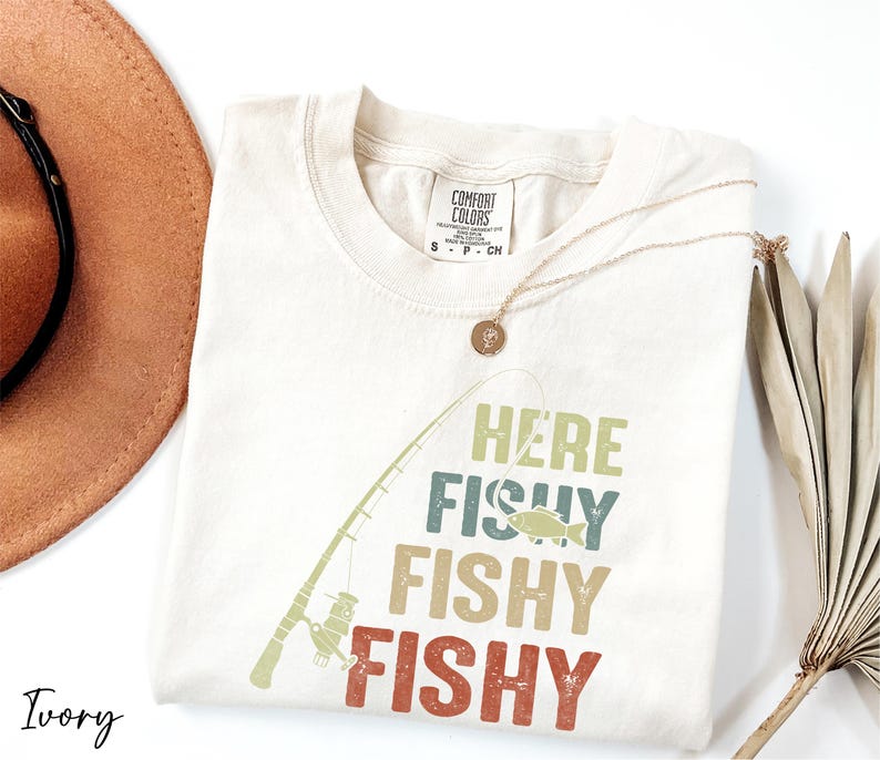 a hat, sunglasses, and a t - shirt with a fish on it