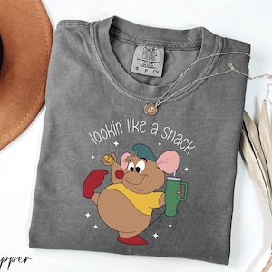 a t - shirt with a cartoon mouse on it