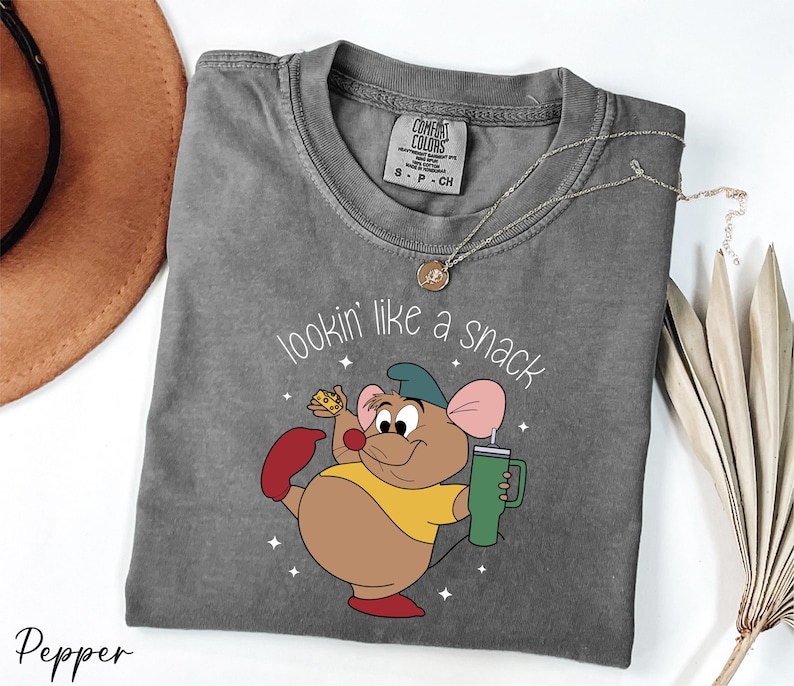 a t - shirt with a cartoon mouse on it