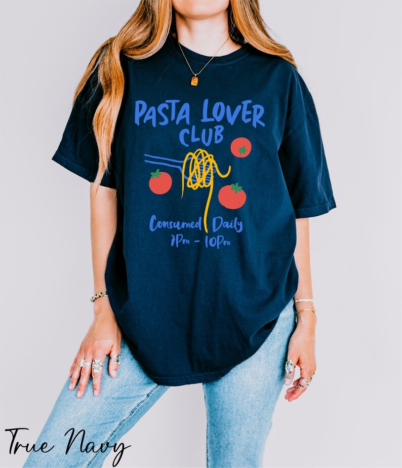 a woman wearing a t - shirt that says pasta lover club