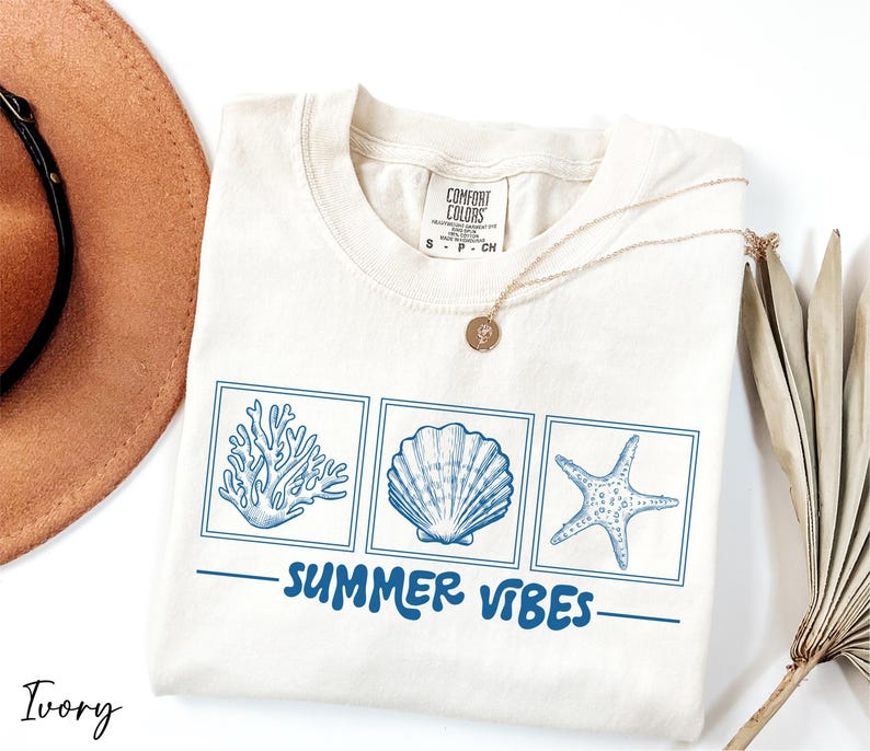 a hat, sunglasses, and a t - shirt with the words summer vibes