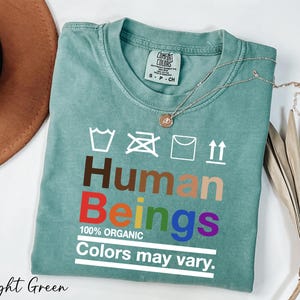 a t - shirt that says human beings colors may vary