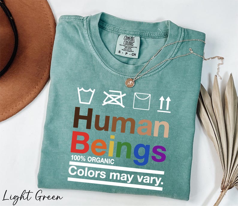 a t - shirt that says human beings colors may vary