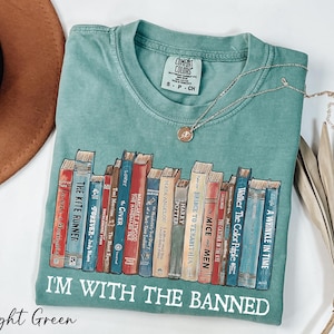 a t - shirt with a bunch of books on it