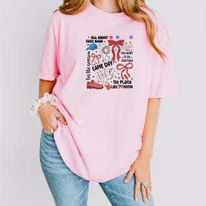 a woman wearing a pink shirt and jeans