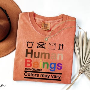 a t - shirt that says human beings on it