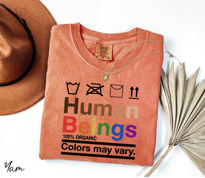 a t - shirt that says human beings on it