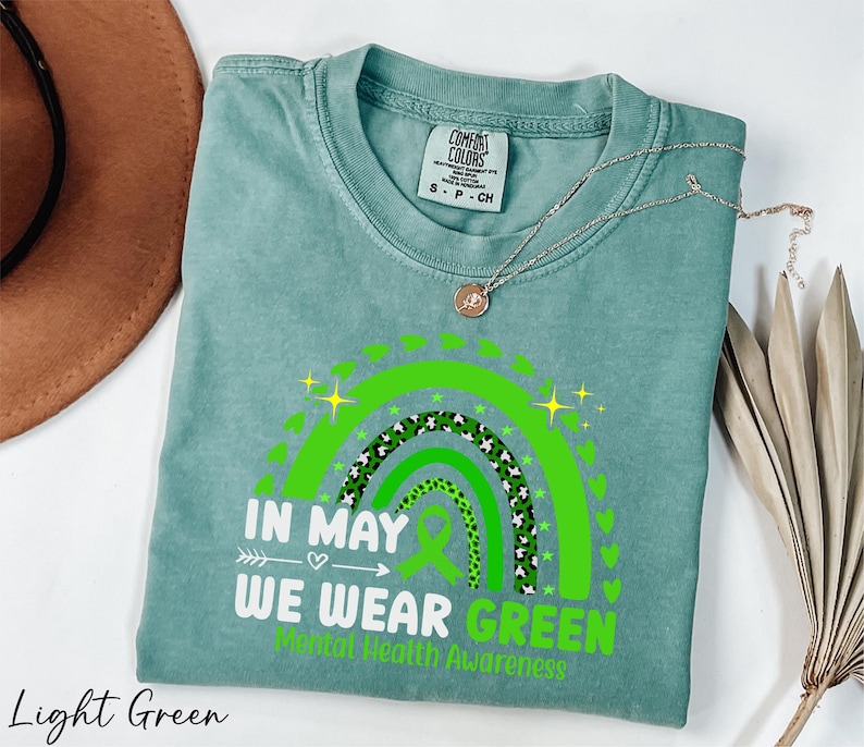 a t - shirt that says in may we wear green