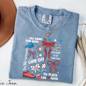 a t - shirt with a picture of a game day on it
