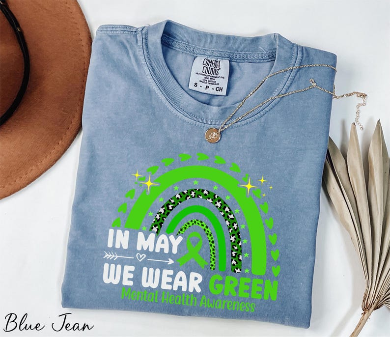 a blue tshirt with a green design on it