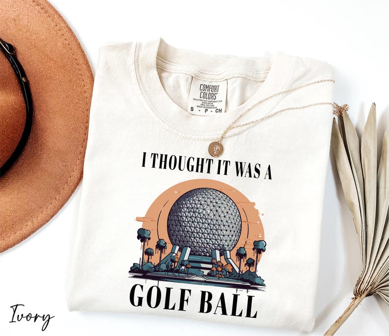 a t - shirt that says i thought it was a golf ball