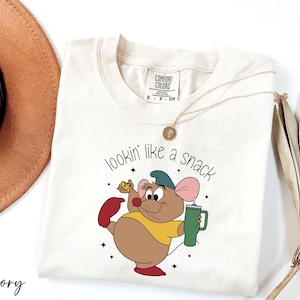 a t - shirt with a cartoon mouse holding a cup of coffee