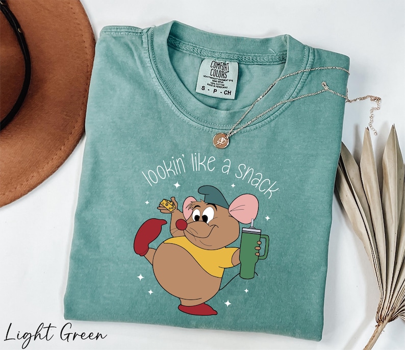 a t - shirt with a cartoon mouse on it