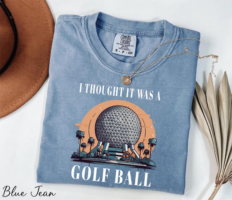 a t - shirt that says i thought it was a golf ball