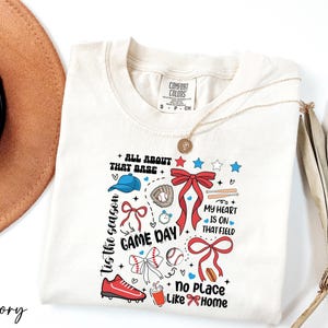 a hat, sunglasses, and a t - shirt with the words game day on