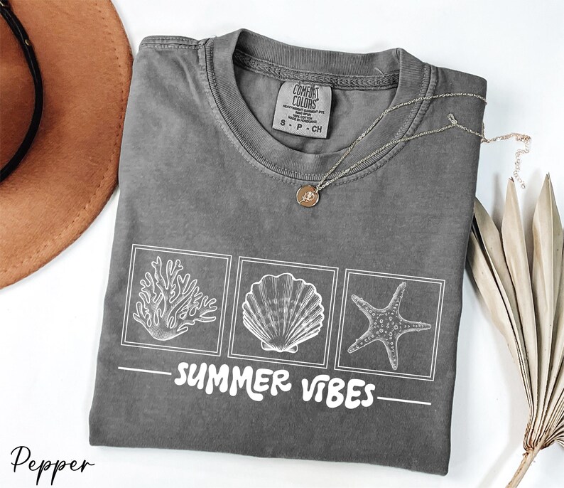a t - shirt that says summer vibes on it