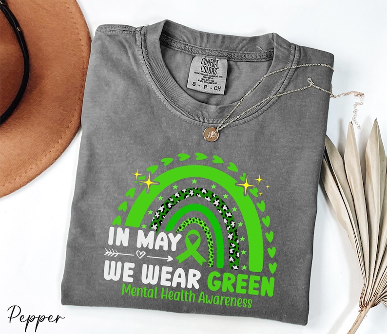 a t - shirt that says in may we wear green