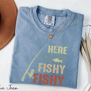 a t - shirt that says here fishy fishy