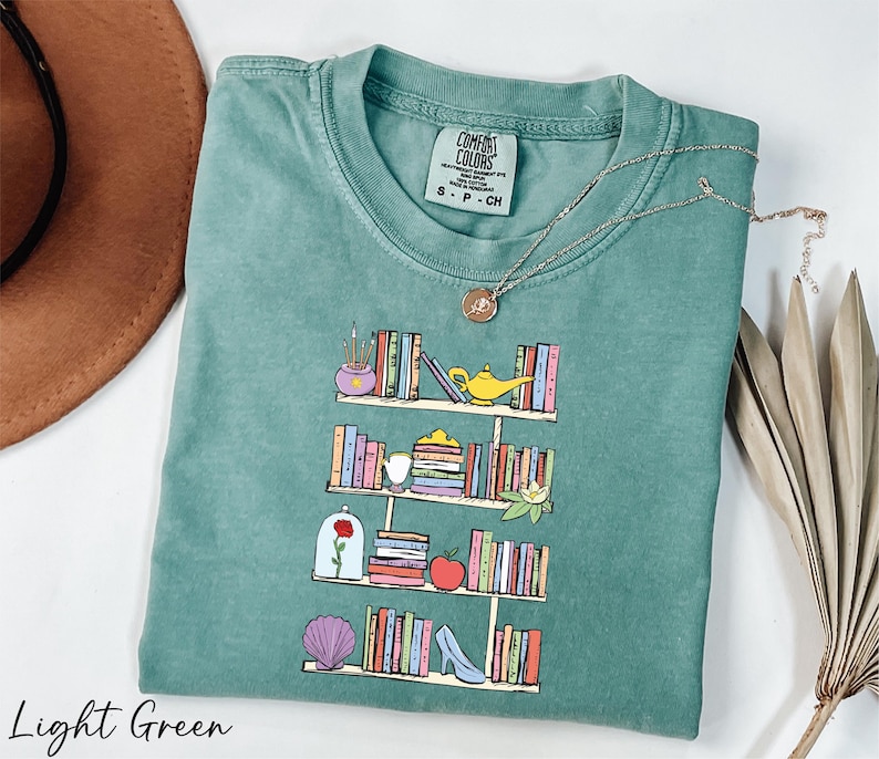 a t - shirt with a picture of a bookshelf on it