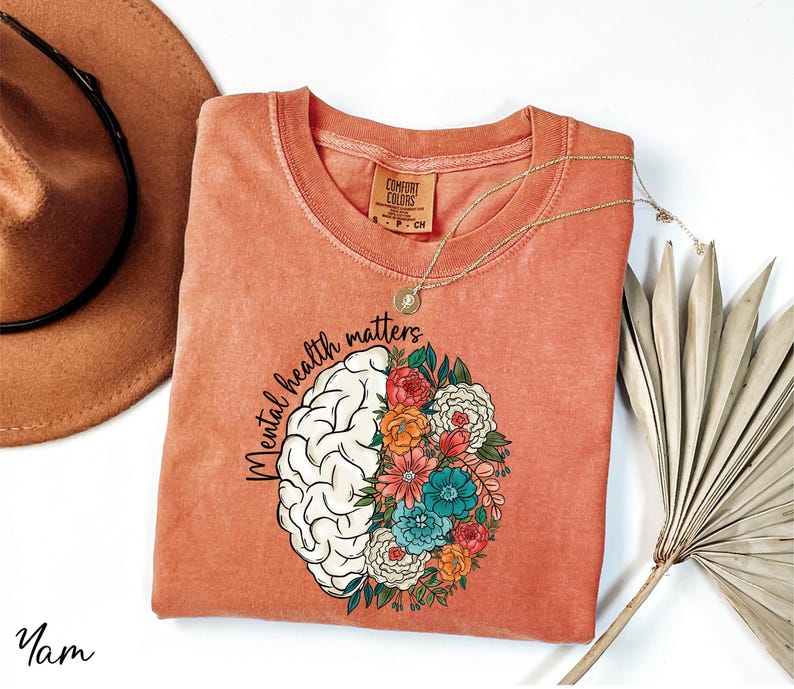 a t - shirt with a picture of a brain and flowers on it